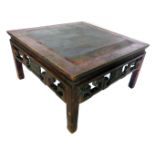 A Chinese hardwood coffee table, the square cleated top above a pierced carved frieze, on shaped leg