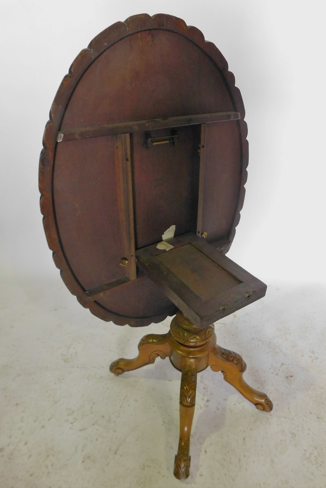 A Victorian walnut and marquetry oval loo table, the top with a carved shaped border, on a turned co - Image 2 of 2