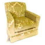 A modern armed chair, in beige and cream flock upholstery.