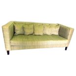 A square three seater settee, upholstered in cream patterned material, on plain legs.