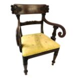 A William IV mahogany bar back elbow chair, with a leaf carved back, scrolling arms, on lappet suppo
