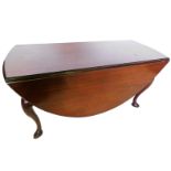 A walnut oval drop leaf table in mid 18thC style, the top with a moulded edge above a shaped apron,