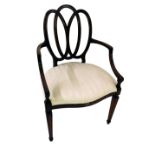 A late 19thC mahogany elbow chair, with an interlaced back, shaped arms, and a padded seat, on squar