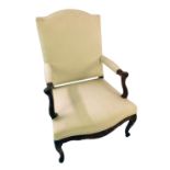 A Continental walnut open armchair, with a padded back, arm rest and seat, upholstered in cream fabr