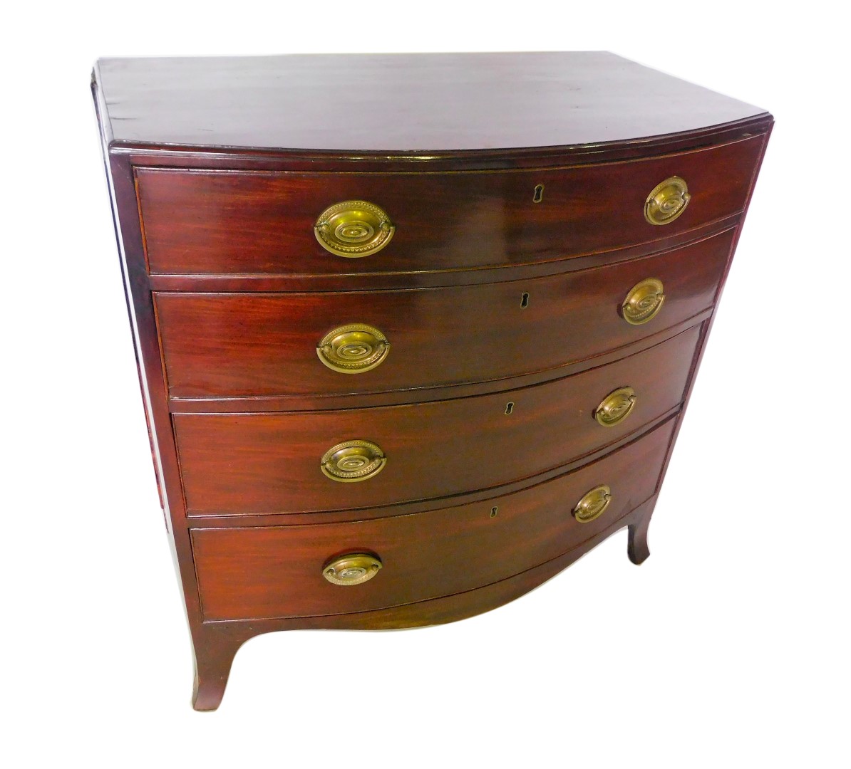 A mid 19thC mahogany bow fronted chest of drawers, the top with a moulded edge, above four graduated