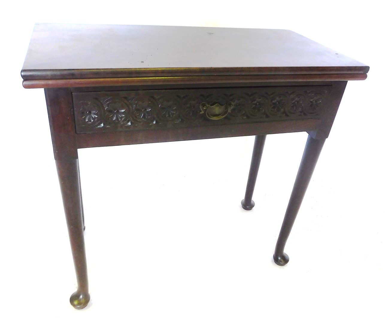 A George III and later mahogany tea table, the rectangular hinged top above a carved frieze drawer w