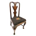 A George II walnut side chair, with solid splat, drop in wool work seat, on cabriole legs with pad f