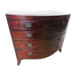 A late George III mahogany satinwood and tulipwood banded bow fronted chest of drawers, of plain for