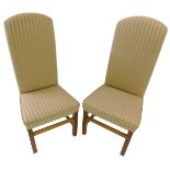 A pair of high back dining chairs, upholstered in pink striped fabric, on square section legs with s