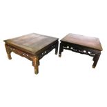 A composite pair of Chinese hardwood coffee tables, each with a cleated square top, a pierced carved