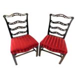 A pair of 19thC mahogany side chairs, each with a pierced ladder back and a red upholstered padded s