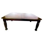 An early Victorian mahogany extending dining table, the rectangular top with moulded edge and rounde