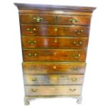 A George III oak chest on chest, with plain moulded cornice, with two drawers above three graduated