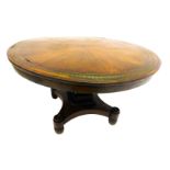 A Regency rosewood circular centre table, with inlaid scrolling brass border to the top and segmente