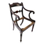A late Regency mahogany elbow chair, with a leaf and tablet carved bar back, scroll shaped arm suppo