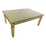 A Continental giltwood and mirrored coffee table, the rectangular top inset with floral silk, with a