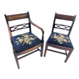 A set of seven Regency mahogany dining chairs, each with a bar back, pierced support a drop in seat,