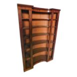 An unusual 19thC mahogany and ebony strung alcove bookcase, with a moulded cornice above six concave