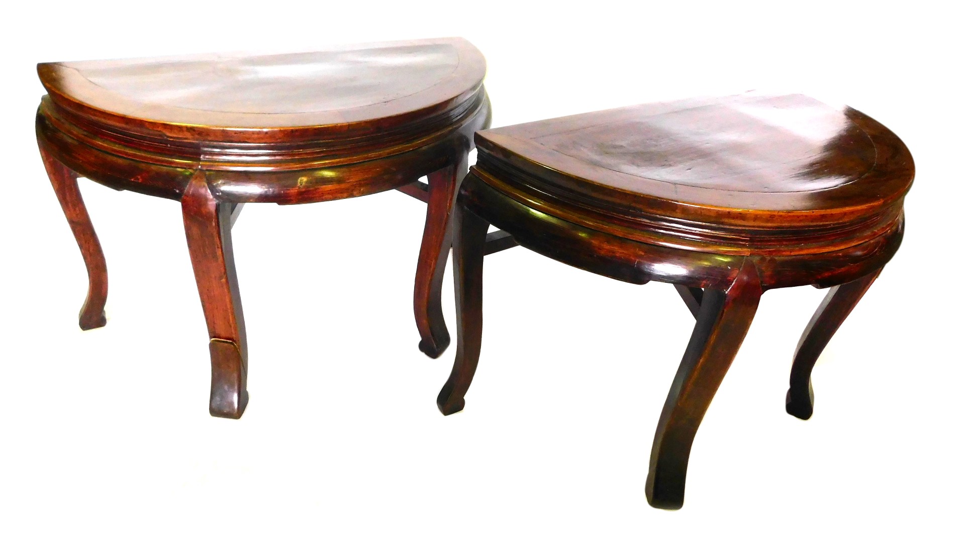 A pair of Chinese hardwood and softwood demi lune shaped console table, each with a plain frieze, on