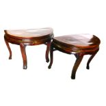 A pair of Chinese hardwood and softwood demi lune shaped console table, each with a plain frieze, on