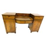 An early 19thC flame mahogany twin pedestal sideboard, with shallow back having two drawers and cent