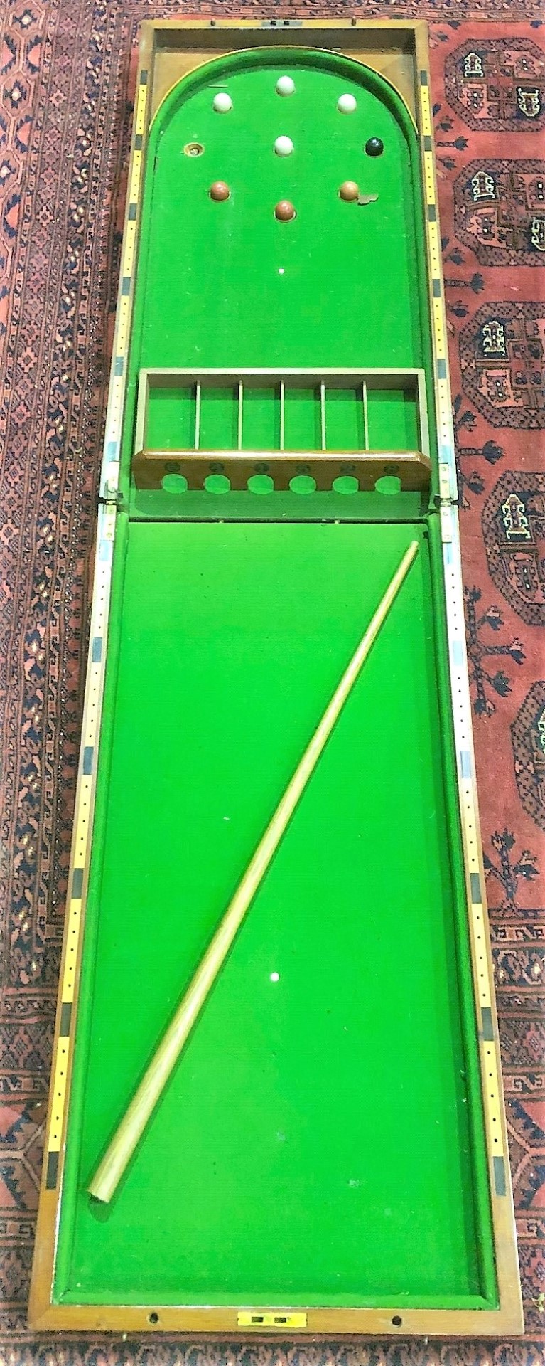 A Victorian mahogany bagatelle folding tabletop game.