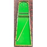 A Victorian mahogany bagatelle folding tabletop game.