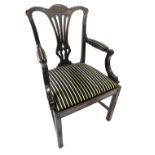 A late 19th/early 20thC mahogany elbow chair, with a carved pierced vase shaped splat, striped fabri