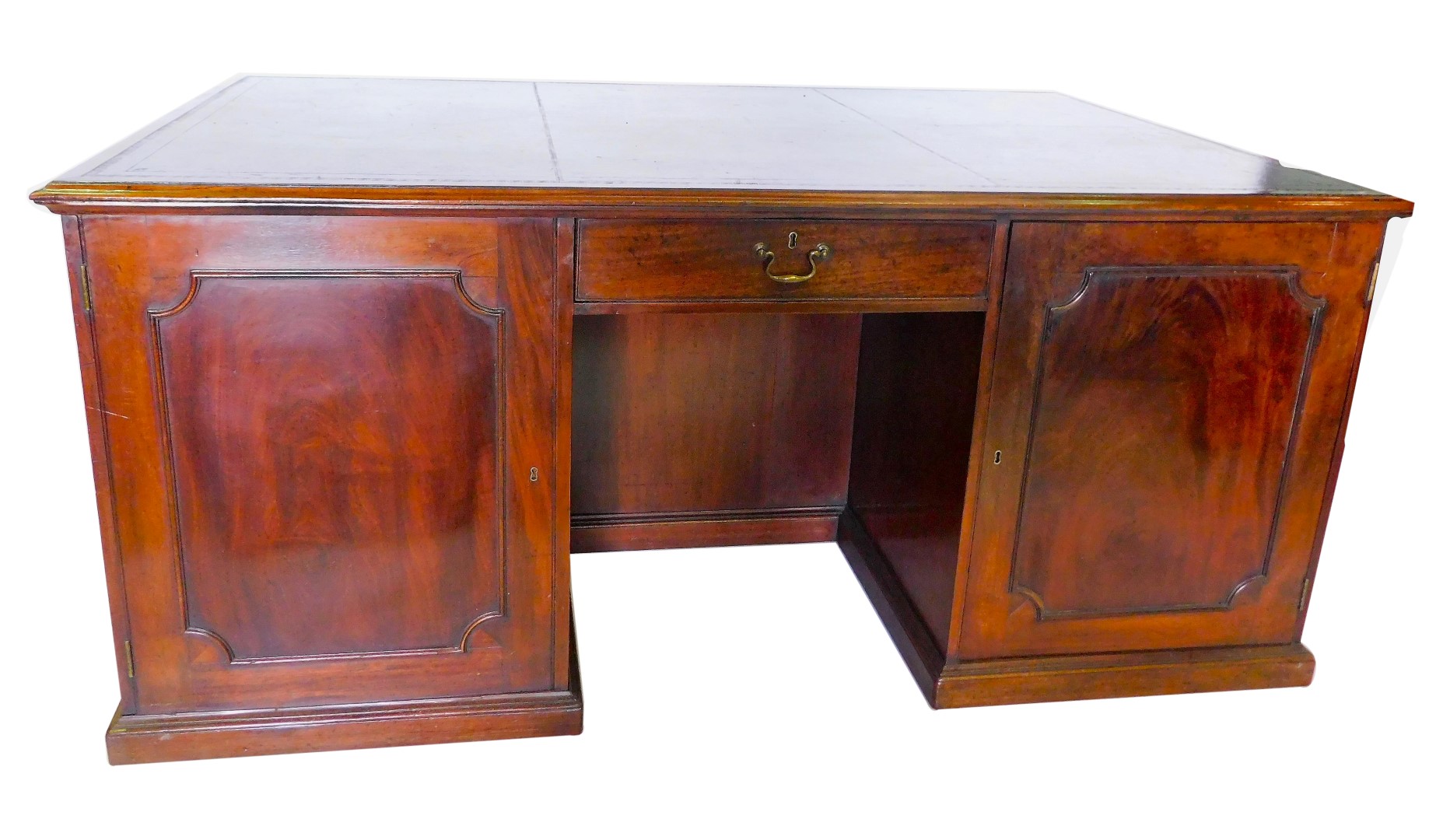 A 19thC mahogany partner's kneehole desk, the rectangular top with a black tooled leather inset and