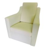 A plain deep seated armed chair, upholstered in white calico, on Shepherd castors.