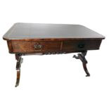 A George IV rosewood writing table, the rectangular top with black and gilt tooled leather inset, ab