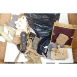 A bag containing various pieces of webbing, gaiters, belts, etc., mainly post war.