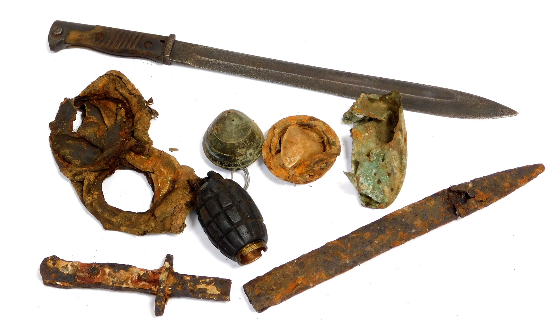 A First World War battlefield relics, to include German Butcher bayonet, and Mills grenade.
