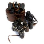 Various binoculars, to include military examples, one being World War I dated.