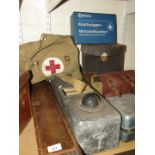 A trench periscope, another, various equipment cases, bag, First Aid kit, and Optimus stove. (8)