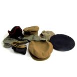 A large quantity of military hats, to include Russian and German examples.