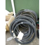 A stock of bicycle tyres, both used and NOS, and various mud guards and accessories.