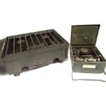 A military safety field cooker, and another. (2)