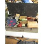 A steel ammo case, containing various sundries including leather pouches, cycle tool kits, lamps, dr