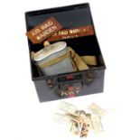 A World War II ARP first aid tin, cigarette cars, bandages, door signs, etc.