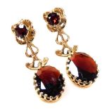 A pair of 9ct gold and garnet set drop earrings, 3.6g.