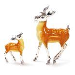 A Saturno silver and enamelled model of a deer, 7.5cm high, together with fawn, 4cm high, each marke