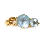 A 9ct gold and aquamarine three stone ring, in a high claw setting, one stone lacking, size M, 2.5g.
