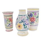 Three Poole pottery vases, each decorated with a central band decorated with flowers with further co