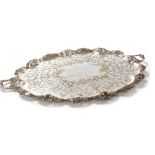A Victorian silver plated twin handled tray, with central floral and foliate engraving, within a rai