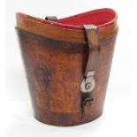 An early 20thC Drew & Sons tanned leather top hat box, lid lacking, 36cm wide.