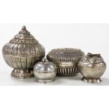 Four Indian white metal trinket boxes, one of cylindrical form, with a conical lid, with incised dec