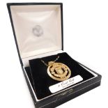 A 9ct gold Manchester United centenary medallion, on a 9ct gold belcher link chain, boxed, 4.0g.