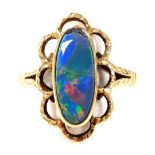 A 9ct gold and imitation opal triplet ring, the oval set stone in a floral leaf surround, size M, 3.
