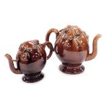 A pair of late 19thC graduated brown stoneware Cadogan teapots, moulded with fruit and flowers, 19cm